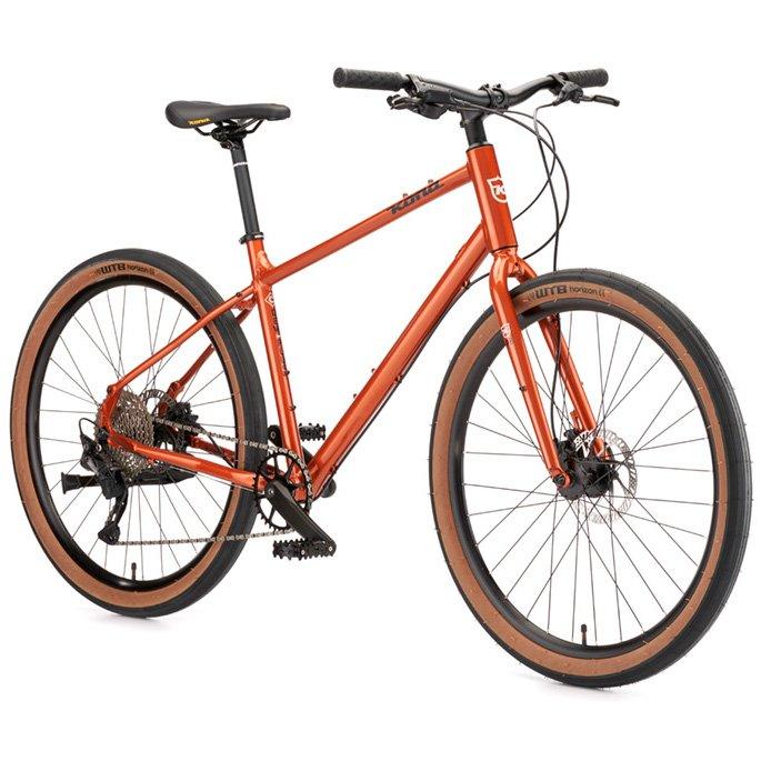 Kona Dew Plus (Orange) - BUMSONTHESADDLE